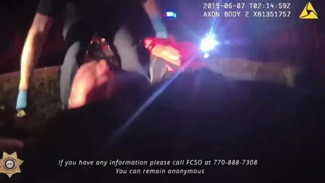 Police cam shows rescue of newborn left in woods